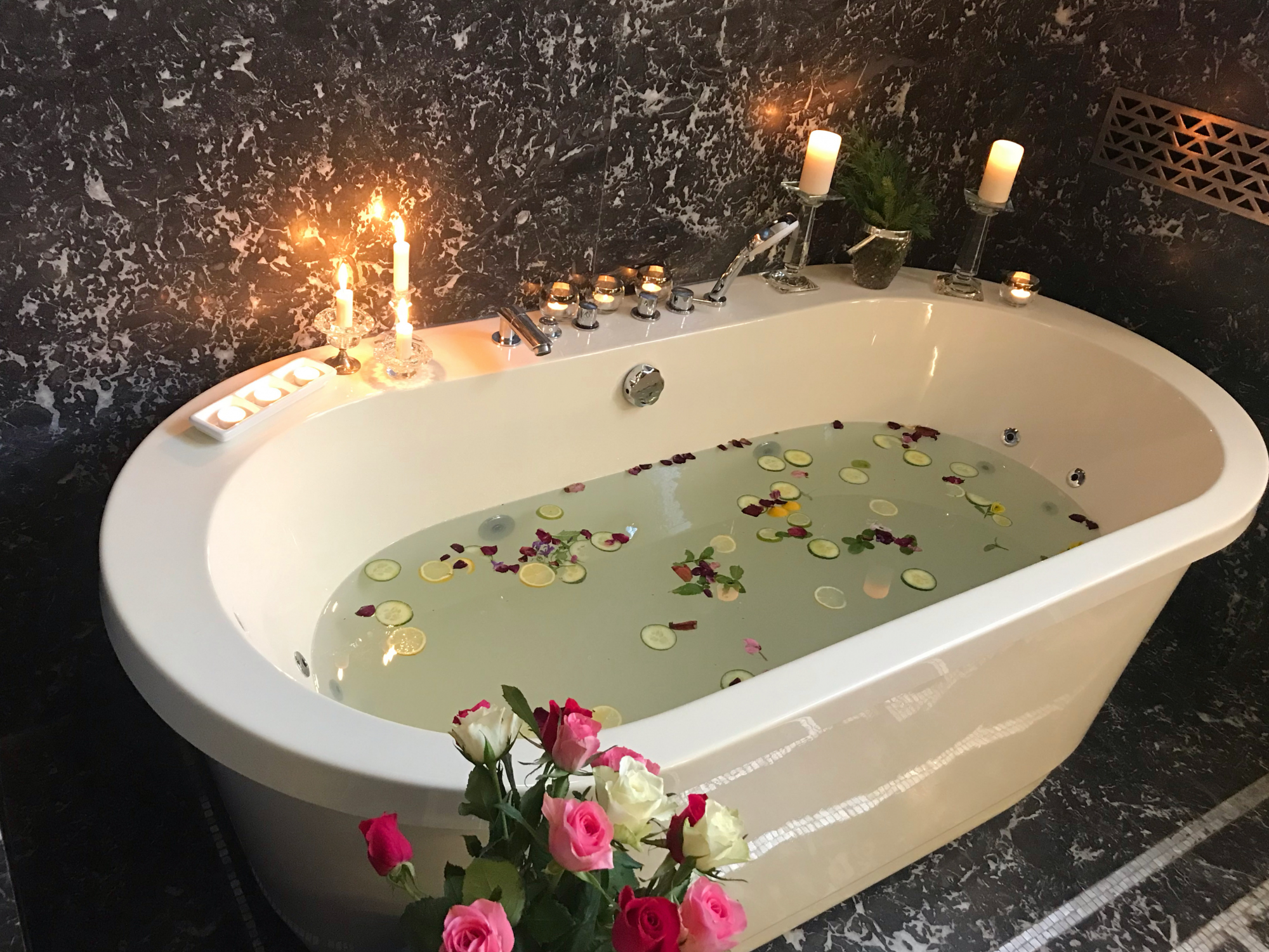 Authentic 1920's details are found in the Art Deco suite black marble bathroom with large soaking tub.  Why not try a citrus infused salt bath to rejuvenate and restore your energy after a day of touring?