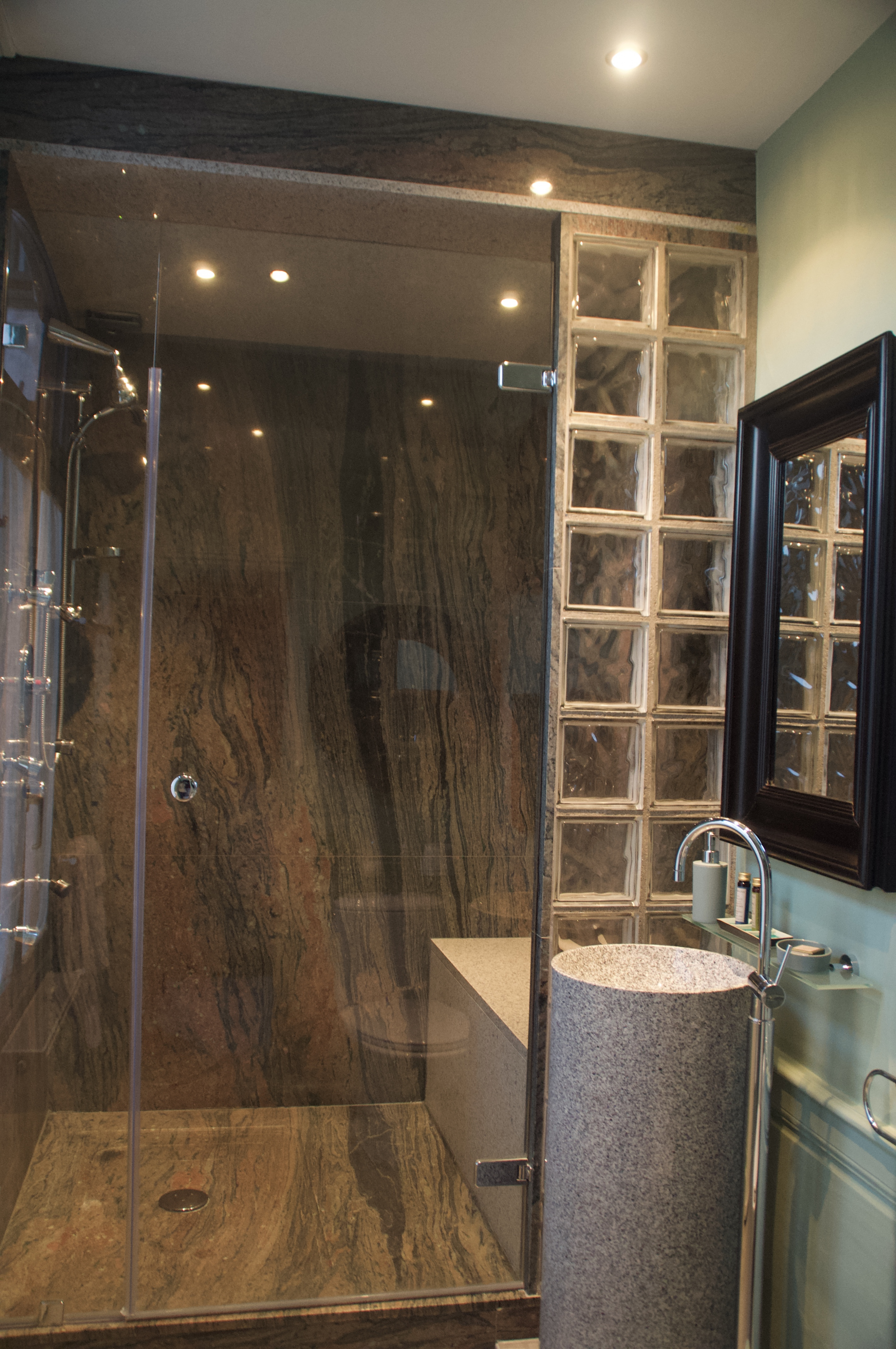 This beautiful granite and glass shower room is located in our Twin suite.