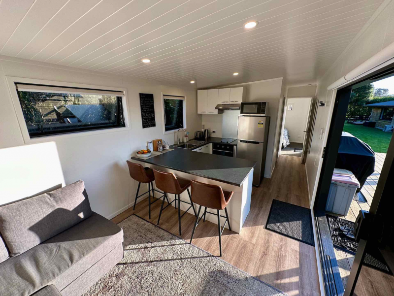 Lounge with kitchen in background
