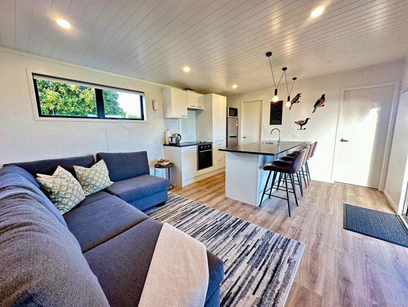 Lounge with kitchen in background