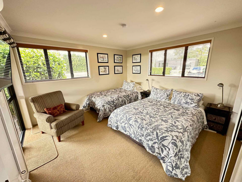 Tui Wing bedroom with queen bed and single bed