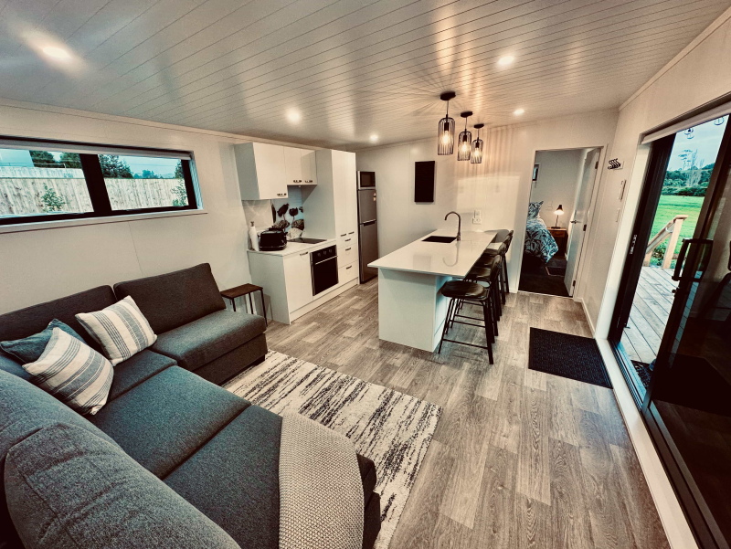 Lounge with kitchen in background