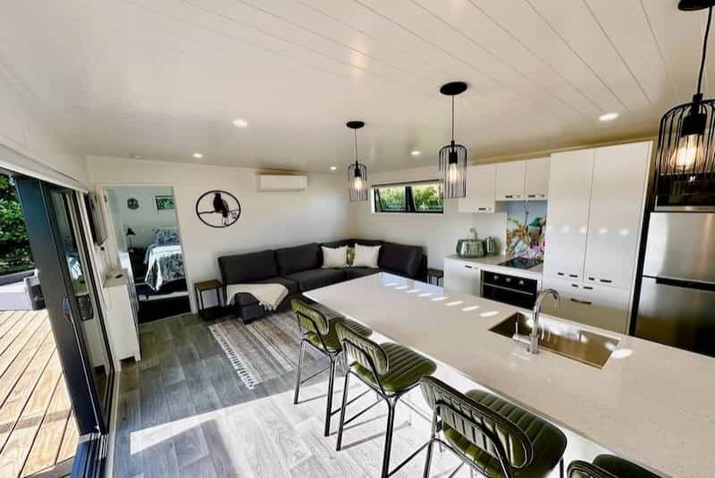 Lounge with kitchen in background